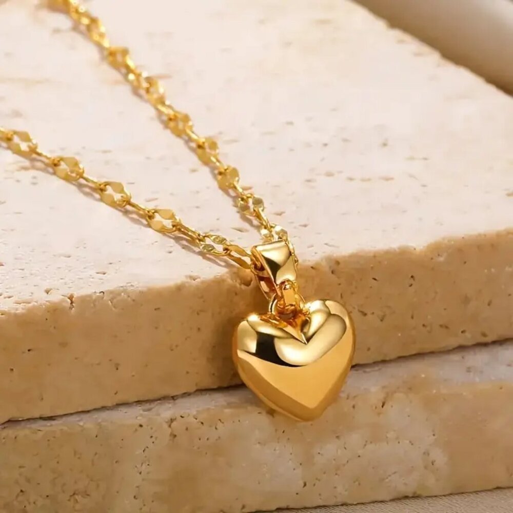 Gold heart necklace on a chain